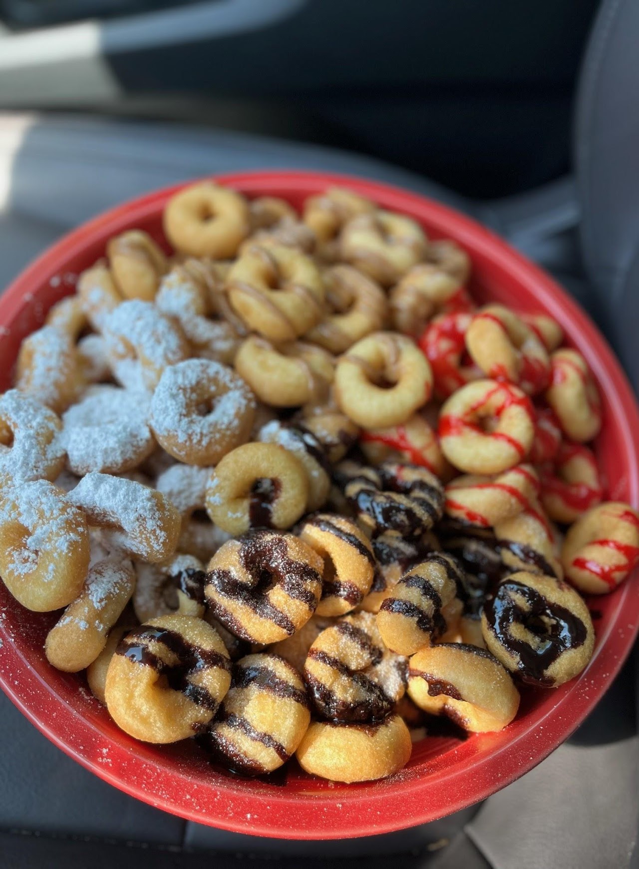 Various types of donuts in a bowl